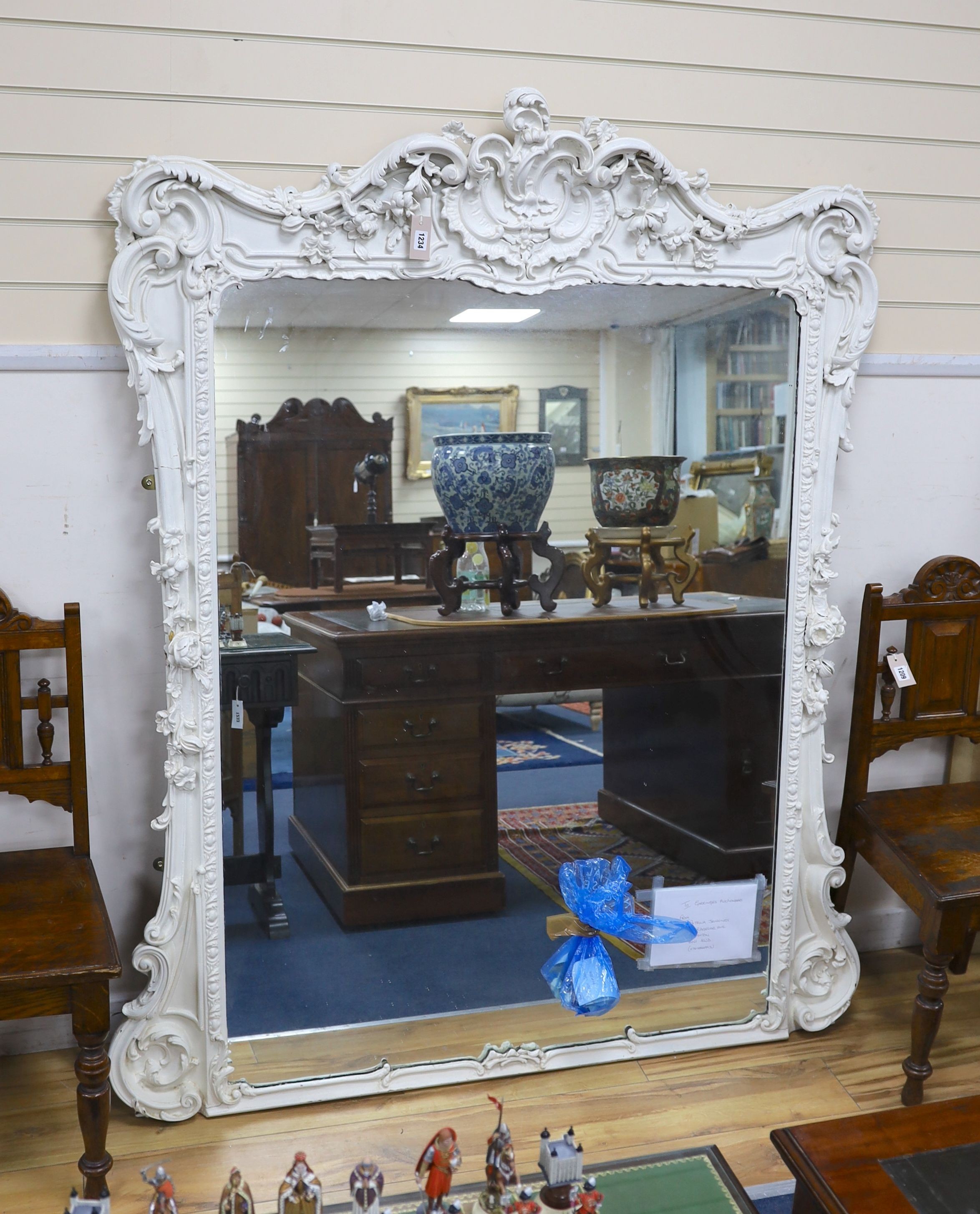 A Victorian carved giltwood and gesso overmantel mirror, later painted white, width 138cm, height 177cm